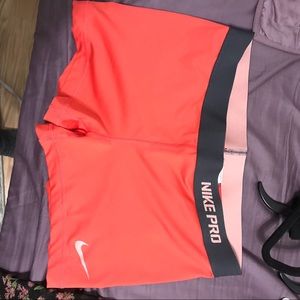 Bright peach Nike pro shorts